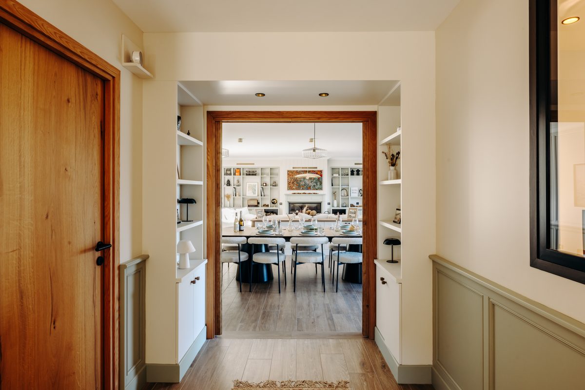 The ground floor's living spaces in a row: living room, dining room and kitchen