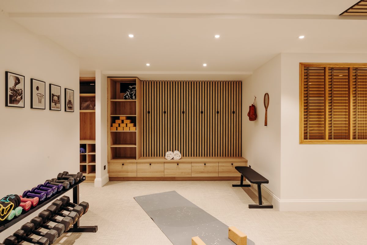 Dumbbells, yoga mats and a weight bench in the villa's gym