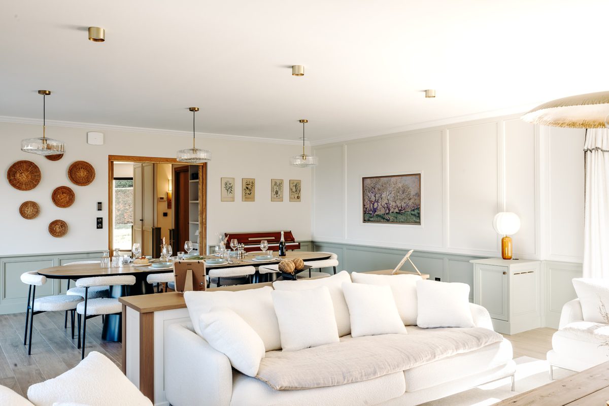 The living room opening onto the dining room, on the Holisty villa's ground floor