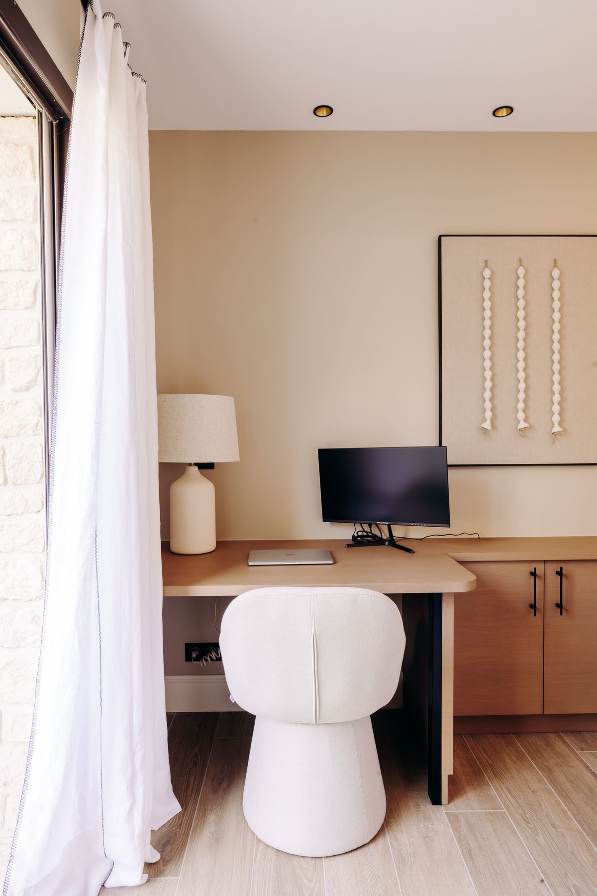Suite 1's desk, facing the window